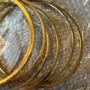 Vintage bangles seven gold coloured bangles